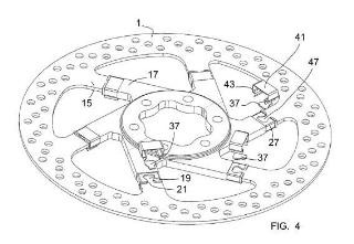 Conjunto de freno de disco para un vehículo con unos medios de anclaje que comprenden un saliente de forma alveolar.